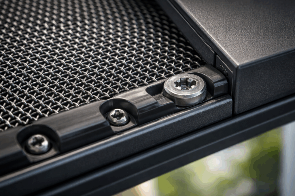 Fitting Crimsafe to Existing Doors and Windows: What You Need to Know 4 Close-up of Crimsafe stainless steel mesh secured into a frame using screw-clamp technology.